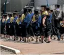  ?? JOSEPH JOHNSON/STUFF ?? Students from University of Canterbury on graduation day walk towards Horncastle Arena.