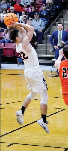 ?? TIMES photograph­s by Annette Beard ?? The visiting Lions traveled through rains to get to Pea Ridge Friday, Jan. 17, then they suffered through rains inside Blackhawk gym as senior Hunter Rains (No. 22) poured in a season high 17 points to lead the Hawks to an easy victory.