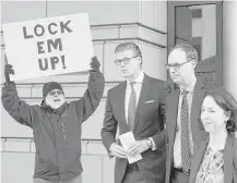  ?? Pablo Martinez Monsivais / Associated Press ?? Alex van der Zwaan, second from left, leaves federal court in Washington on Tuesday after being sentenced to 30 days in prison for lying in the Russia election meddling probe.