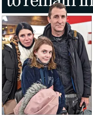  ?? ?? SAFE RETURN: Paul Meakin with his wife and daughter at Gatwick Airport yesterday