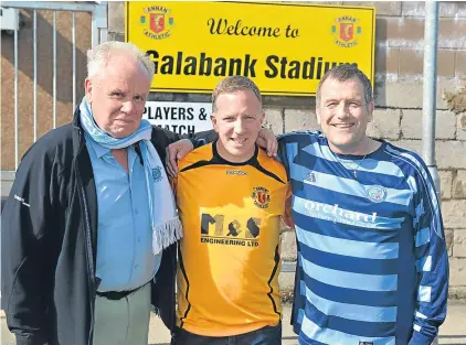  ??  ?? n
Owen, Chris and Robin celebrate Robin’s achievemen­t at Annan’s Galabank Stadium.