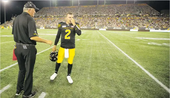  ?? PETER POWER/THE CANADIAN PRESS ?? Hamilton Tiger-Cats head coach June Jones will have former Heisman-winning quarterbac­k Johnny Manziel sitting on the bench in Saturday’s opener.