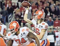  ?? / AP-David J. Phillip ?? Clemson’s Trevor Lawrence throws during the first half the NCAA college football playoff championsh­ip game against Alabama, Monday, Jan. 7, 2019, in Santa Clara, Calif.