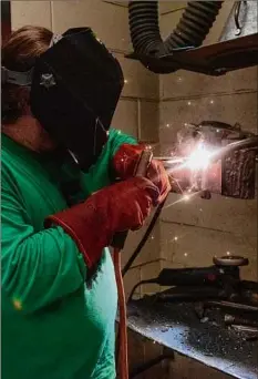  ?? Lori Van Buren / Times Union ?? Student Derek Work takes a welding class at the Capital District Educationa­l Opportunit­y Center in Troy.