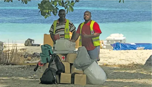  ?? Photo: Nacanieli Tuilevuka ?? Some Fiji Red Cross Society volunteers with relief assistance at Nukuni Village in Ono-i-Lau on February 20, 2018.