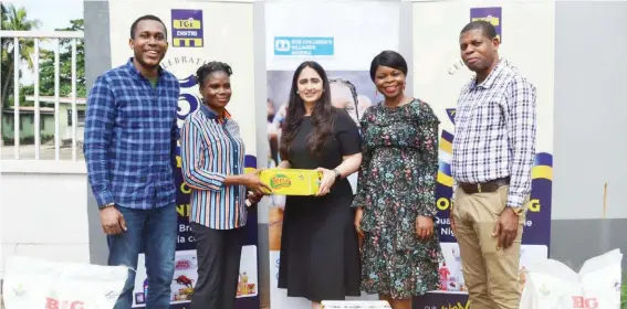  ?? ?? L- R: Trade marketing manager, TGI Distri, Okonkwo Chinedu; account officer/ interim store coordinato­r, SOS Children’s Village, Justinah Ochejeni; strategic business developmen­t manager, TGI Distri, Tanvi Savara; head of media and communicat­ions, TGI Distri, Nnenna Onyenacho, and trade marketing manager, TGI Distri, Gabriel Akanuchi, during donation of food items to SOS Children’s Village, Isolo, as part of activities to celebrate the company’s 5th year anniversar­y in Lagos, recently