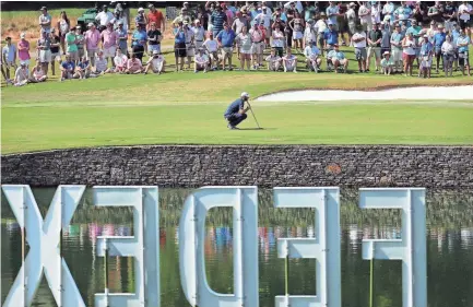  ??  ?? Dustin Johnson eyes a putt on the 14th hole during the final round of the Fedex St. Jude Classic Golf Tournament on June 10, 2018. JIM WEBER/THE COMMERCIAL APPEAL