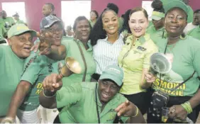  ?? (Photo: Garfield Robinson) ?? Members of the JLP’S Area Council One celebrate with guest speaker Ann-marie Vaz following a meeting on Sunday.