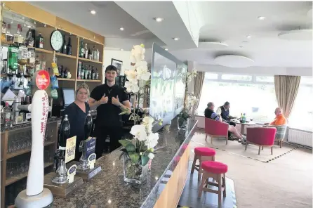  ??  ?? The Kingsdown Golf Club bar staff wait for the 3pm on-rush after the clubhouse reopened on Tuesday