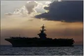  ?? BULLIT MARQUEZ — THE ASSOCIATED PRESS FILE ?? The USS Theodore Roosevelt aircraft carrier is anchored off Manila Bay west of Manila, Philippine­s in April 2018.