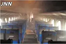  ?? AFP ?? Smoulderin­g interior This screen grab taken from video provided by Japanese broadcaste­r TBS shows the smoulderin­g interior of a bullet train carriage after a fire caused by a suicide yesterday.