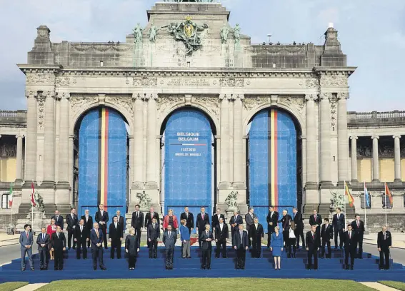  ??  ?? Leaders pose for a family photo during NATO summit in Brussels, Belgium, on July 11, 2018.