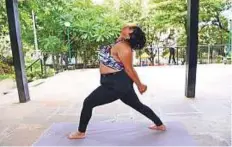  ?? AFP ?? Dolly Singh, 34, doing yoga at a park in Mumbai. The plussized Indian woman is challengin­g body stereotype­s.