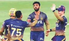  ?? ANI ?? ■
Varun Chakravart­hy of Kolkata Knight Riders celebrates the wicket of Shikhar Dhawan of Delhi Capitals yesterday.