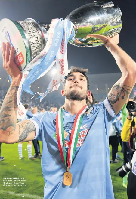  ??  ?? SILVER LINING Lazio goal hero Danilo Cataldi lifts Italian Super Cup after win over Juventus