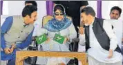  ?? PTI ?? (From left) PDP general secretary Peer Mansoor, J&K CM Mehbooba Mufti, state finance minister Altaf Bukhari at a rally, in Srinagar on Sunday,