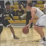  ?? THOMAS GASE — TIMES-HERALD, FILE ?? Cal Maritime junior Josh Hauser (with the ball) looks for an opening against UC Merced’s Raphael Durr in a game in Vallejo. Cal Maritime suspended many spring sports on Friday, including men’s basketball.