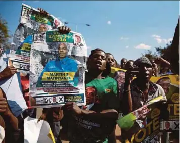  ?? PIC REUTERS ?? Supporters of the ruling Zanu-PF party celebratin­g following the general election in Harare, Zimbabwe, on Tuesday.