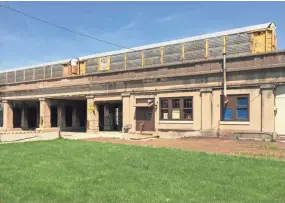  ?? TOM DAYKIN / MILWAUKEE JOURNAL SENTINEL ?? The Model Railroad Club of Milwaukee Inc.'s clubhouse is in a historic former passenger train station at 215 E. National Ave. The building is built into a Canadian Pacific Railway bridge that spans the street.