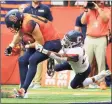  ?? Rich Barnes / Getty Images ?? Syracuse’s Gabe Horan (88) is tackled by UConn’s Omar Fortt (27) during a 2018 game at the Carrier Dome.