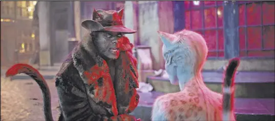  ?? Universal Pictures ?? Macavity (Idris Elba) and Victoria (Francesca Hayward) in the big-screen adaptation of “Cats.”