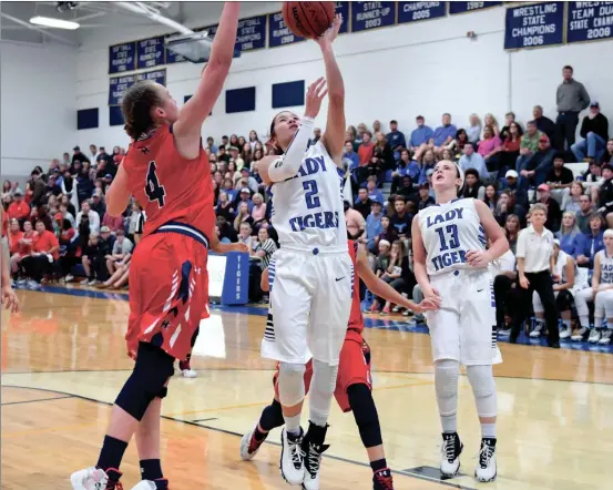  ??  ?? Kiwi Dale scored 13 points for Ringgold on Thursday in the Tigers’ 60-45 win over visiting Heritage. (Ringgold Tigers Shoots/Courtney Couey)