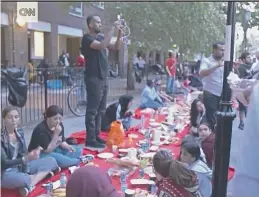  ??  ?? Act of solidarity: Screengrab of a street ‘iftar’ for the Grenfell Tower fire victims in London which highlights unity in the community.