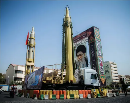  ?? (Nazanin Tabatabaee Yazdi/TIMA/Reuters) ?? A DISPLAY featuring missiles and a portrait of Iran’s Supreme Leader Ayatollah Ali Khamenei is seen at Baharestan Square in Tehran last year.