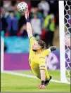  ?? (AP) ?? Italy’s goalkeeper Gianluigi Donnarumma saves a shootout penalty during the Euro 2020 soccer semifinal match between Italy and Spain at Wembley stadium in London.