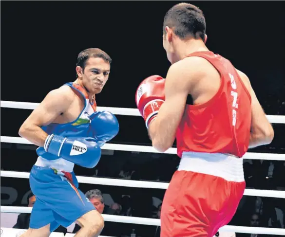  ?? BFI ?? ■ Amit Panghal (left) lost to Uzbekistan’s Shakhobidi­n Zoirov in an intense 52kg category final in Ekaterinbu­rg, Russia on Saturday.