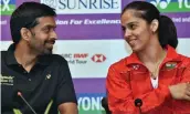  ?? — PTI ?? India badminton coach Pullela Gopichand ( left) with Saina Nehwal in New Delhi on Tuesday.