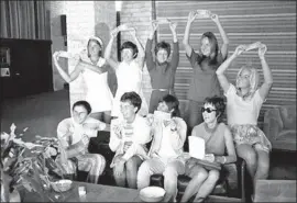  ?? Houston Post Collection/Houston Metropolit­an Research Center/Houston Public Library ?? THE ORIGINAL NINE tennis players pose with their dollar bills in 1970 at the Houston Racquet Club. Standing from left: Valerie Ziegenfuss, Billie Jean King, Nancy Richey and Peaches Bartkowicz. Sitting from left: Judy Tegart Dalton, Kerry Melville Reid, Rosie Casals, promoter Gladys Heldman and Kristy Pigeon.