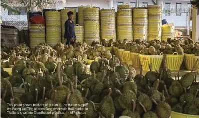  ?? ?? This photo shows baskets of durian at the durian suppliers Paeng Jae Ting at Noen Sung wholesale fruit market in Thailand’s eastern Chanthabur­i province. — AFP photos