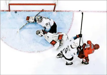  ?? BRUCE BENNETT/GETTY ?? Nikolai Prokhorkin, right, scores in the first period against the U.S. in the Olympic Athletes from Russia’s 4-0 pool-play victory Saturday.