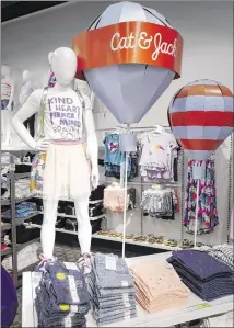  ?? MARK LENNIHAN / ASOOCIATED PRESS ?? Cat & Jack jeans and T-shirts appear on display at a Target store in New York. The clothes are made with Repreve polyester fabric, created from recycled plastic bottles.