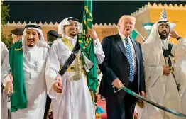  ??  ?? (Top) US President Donald Trump and his host and Saudi Arabia King Salman join the sword dance in Riyadh.