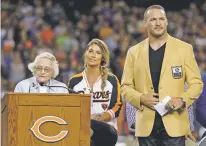  ?? NAM Y. HUH/ASSOCIATED PRESS ?? Bears owner Virginia Halas McCaskey, left, speaks Monday as former Chicago and Hall of Fame linebacker Brian Urlacher listens during a Ring of Excellence ceremony during halftime in Chicago.
