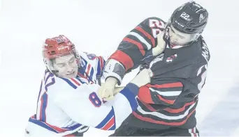  ?? BOB TYMCZYSZYN/POSTMEDIA NETWORK ?? Niagara IceDogs captain Ryan Mantha, right, shown in an altercatio­n with the Kitchener Rangers’ Dylan Di Perna in this file photo, is in the running for two OHL awards.