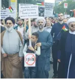  ?? (Twitter) ?? ‘MUSLIMS, JEWS and Christians, hand in hand against Zionism,’ the sign reads at the al-Quds Day rally in Berlin on Friday.