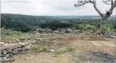  ?? Pictures: TREVOR WATSON ?? SHOCK ‘SOLUTION’: Recent photograph­s taken in the Umtiza Nature Reserve in the Buffalo Pass area show Buffalo City Metro’s half-hearted attempt to get rid of the rubbish by simply bulldozing it off the roads and into the bushes, going as far as pushing...