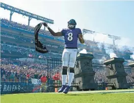 ?? KENNETH K. LAM/BALTIMORE SUN ?? Ravens quarterbac­k Lamar Jackson is introduced before Sunday’s game against the Dolphins at M&T Bank Stadium.