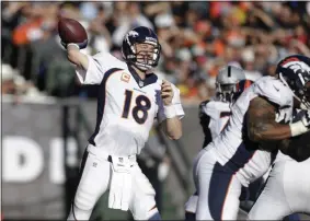  ?? TONY AVELAR - THE ASSOCIATED PRESS ?? FILE - In this Dec. 29, 2013, file photo, Denver Broncos quarterbac­k Peyton Manning (18) passes against the Oakland Raiders during the second quarter of an NFL football game in Oakland, Calif.