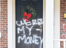  ?? TIMOTHY D. EASLEY/AP ?? Graffiti is seen on a door of the home of Senate Majority Leader Mitch McConnell on Saturday in Louisville, Kentucky.