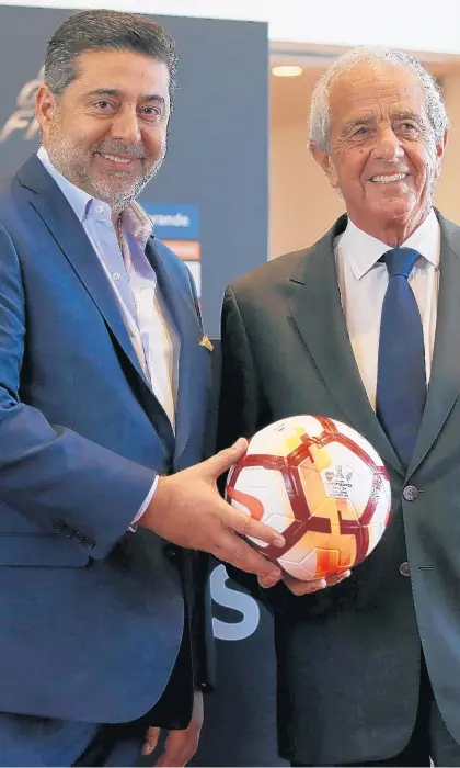 ?? AGUSTIN MARCARIAN/GETTY ?? President of Boca Juniors Daniel Angelici, left, and President of River Plate Rodolfo D’Onofrio pose for a photo Friday in Buenos Aires.