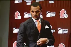  ?? Ron Schwane / Associated Press ?? Cleveland Browns new quarterbac­k Deshaun Watson enters a news conference at the team’s training facility on March 25 in Berea, Ohio.