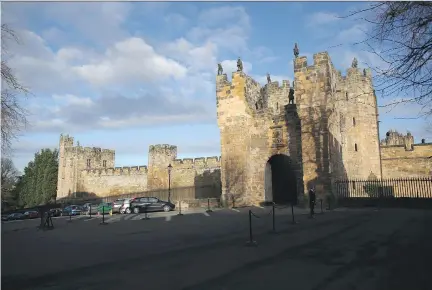  ?? CHRISTOPHE­R FURLONG / GETTY IMAGES ?? Alnwick Castle is strategica­lly located on the River Aln, not far from the Scottish border. It has appeared in two Harry Potter movies and was the setting for the fifth- season finale of Downton Abbey. The Poison Garden is full of deadly, beautiful...