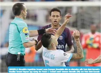  ??  ?? MARSEILLE: Marseille’s Argentinia­n forward Lucas Ocampos (down)falls after an altercatio­n with Paris Saint-Germain’s Brazilian forward Neymar (up) during the French L1 football match between Marseille (OM) and Paris Saint-Germain (PSG).— AFP