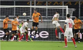  ??  ?? Sevilla’s Lucas Ocampos (right) scores the only goal of the game from Éver Banega’s cross. Photograph: Ina Fassbender/Reuters