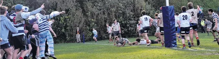  ?? PHOTO: PETER MCINTOSH ?? Matchwinne­r . . . Otago Boys’ High School first XV halfback James Arscott scores the winning try against the John McGlashan College first XV at Littlebour­ne on Saturday.