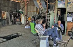  ??  ?? Matias Soriano (left) chats with his mechanic as they sip their mates in a shed at their home.